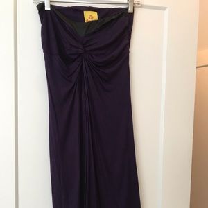 Purple strapless dress with black trim on the top